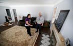 Paul Teeter and Anna Case looked at the tile work in their new 2,100 square-foot, three-bedroom home Wednesday Feb 21, 2018 in Richfield, MN.