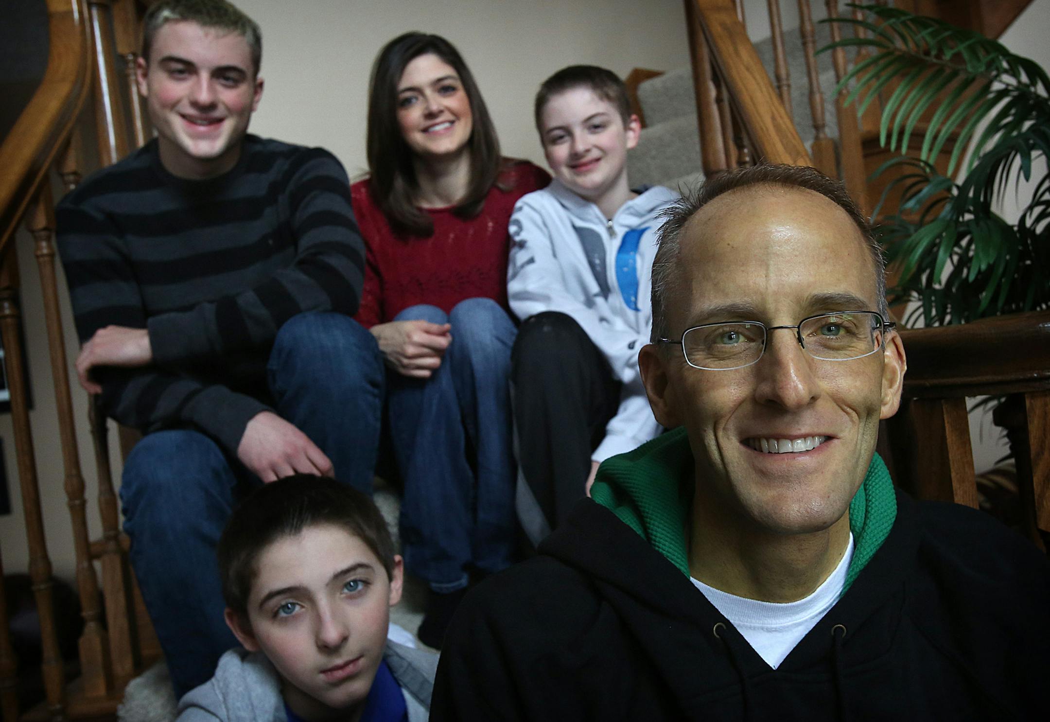 Lt. Col. Mark Weber, with his wife, Kristin and their sons, Matthew, 17, and twins Joshua (white sweat shirt) and Noah, 12.