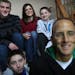 Lt. Col. Mark Weber, with his wife, Kristin and their sons, Matthew, 17, and twins Joshua (white sweat shirt) and Noah, 12.