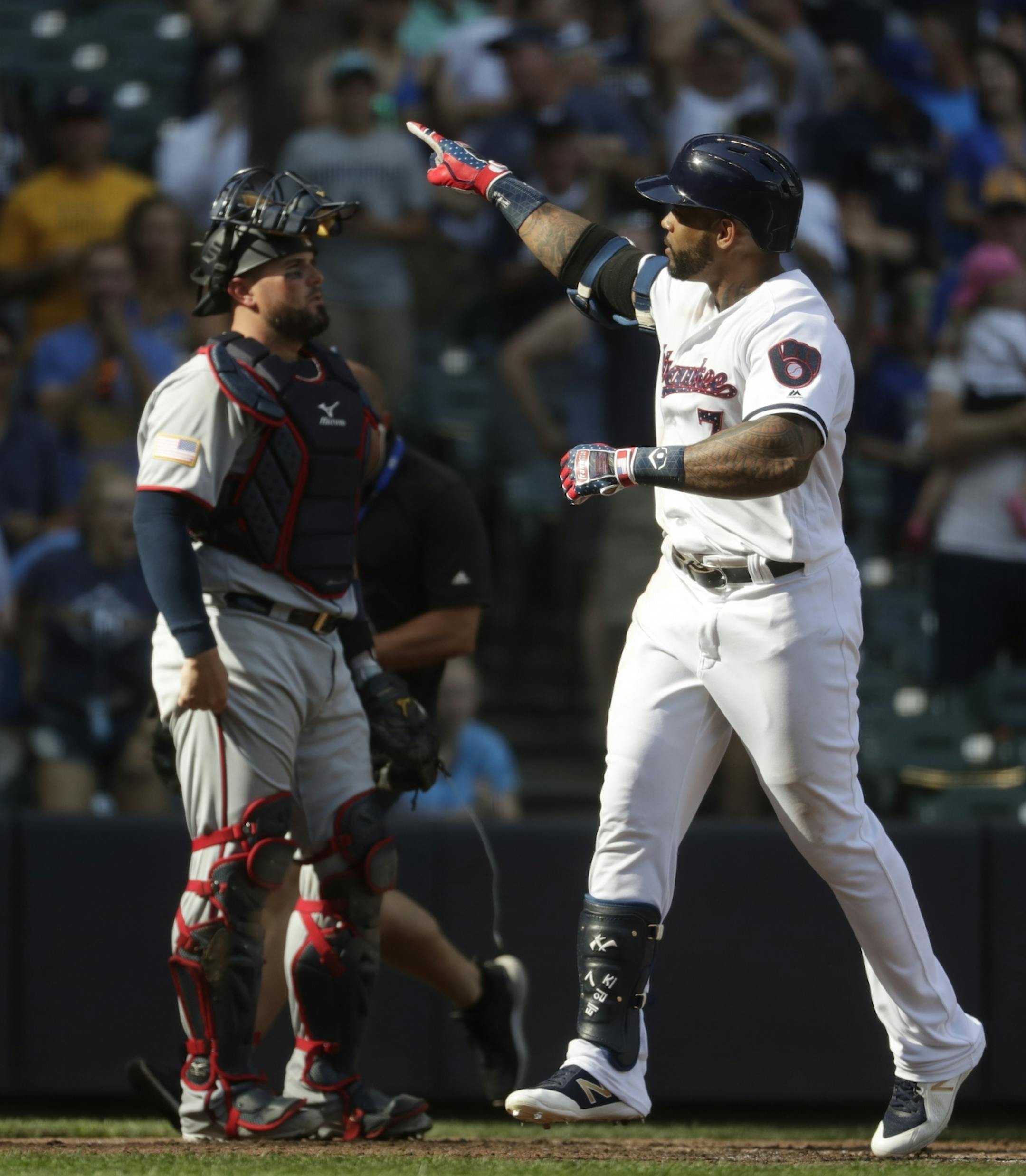 Milwaukee Brewers' Eric Thames celebrates his two-run home run during the fifth inning of a baseball game against the Minnesota Twins Tuesday, July 3, 2018, in Milwaukee.