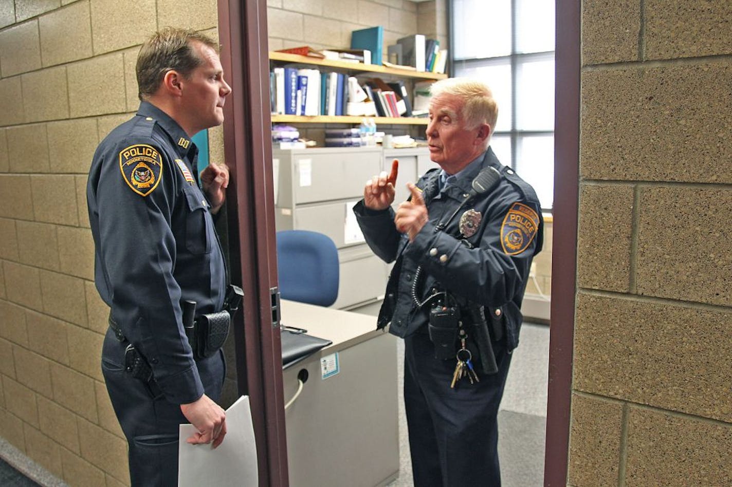 Minnetonka Police Reserve Billy Gerard checked in with Captain Scott Boerboom before his routine shift, Thursday, January 24, 2013. (ELIZABETH FLORES/STAR TRIBUNE) ELIZABETH FLORES � eflores@startribune.com