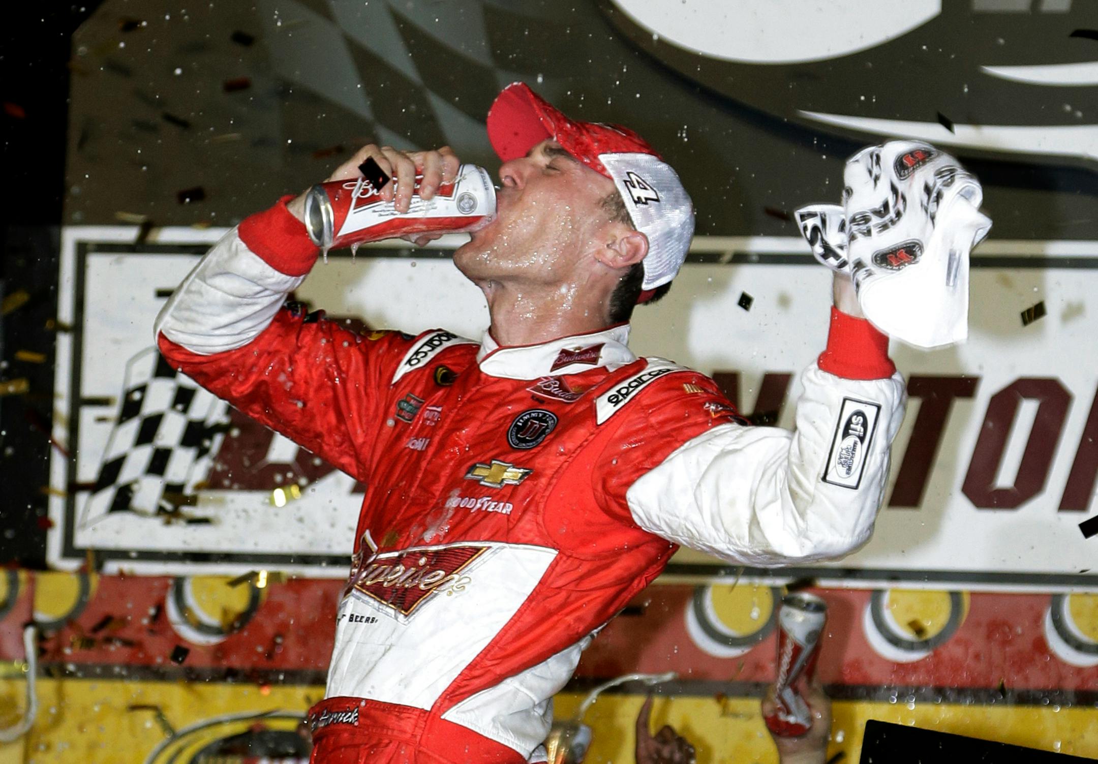 Kevin Harvick celebrates in Victory Lane after winning the NASCAR Sprint Cup series auto race at Darlington Raceway in Darlington, S.C., Saturday, April 12, 2014. (AP Photo/Chuck Burton)