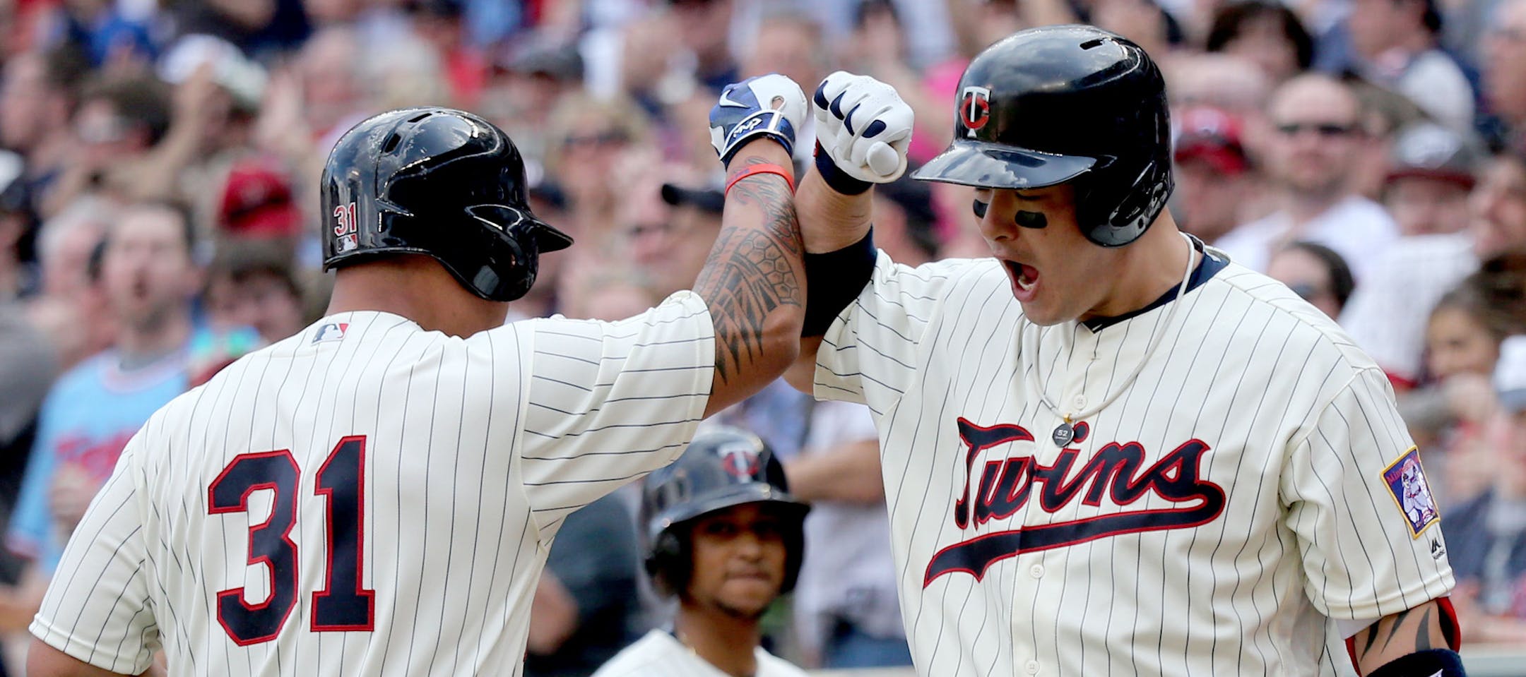The Minnesota Twins Oswaldo Arcia, left, is greeted by teammate Byung Ho Park after Arcia homered to give the Twins the lead in the 8th inning. Park then followed with a homer and Minnesota beat Los Angeles Angels 6-4 Saturday, April 16, 2016, at Target Field in Minneapolis, MN.](DAVID JOLES/STARTRIBUNE)djoles@startribune.com Minnesota Twins vs Los Angeles Angels
