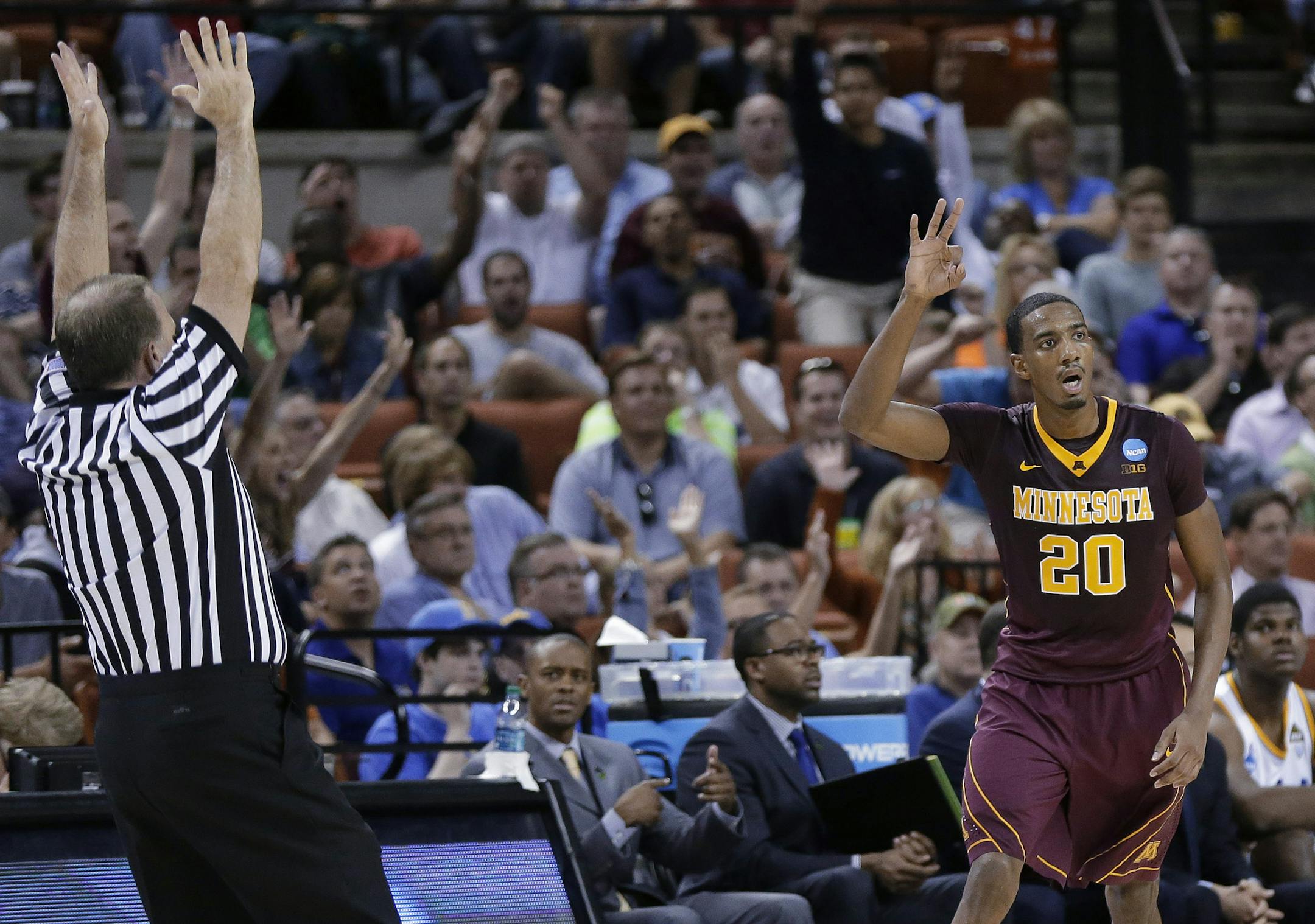Minnesota's Austin Hollins (20) gestures after a 3-point shot against UCLA during the first half of a second-round game of the NCAA men's college basketball tournament Friday, March 22, 2013, in Austin, Texas. (AP Photo/Eric Gay) ORG XMIT: TXEG131