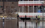 Pedestrians came out to view the flooding at Harriet Island Regional Park in St. Paul and the flowing Mississippi River on March, 26, 2019.