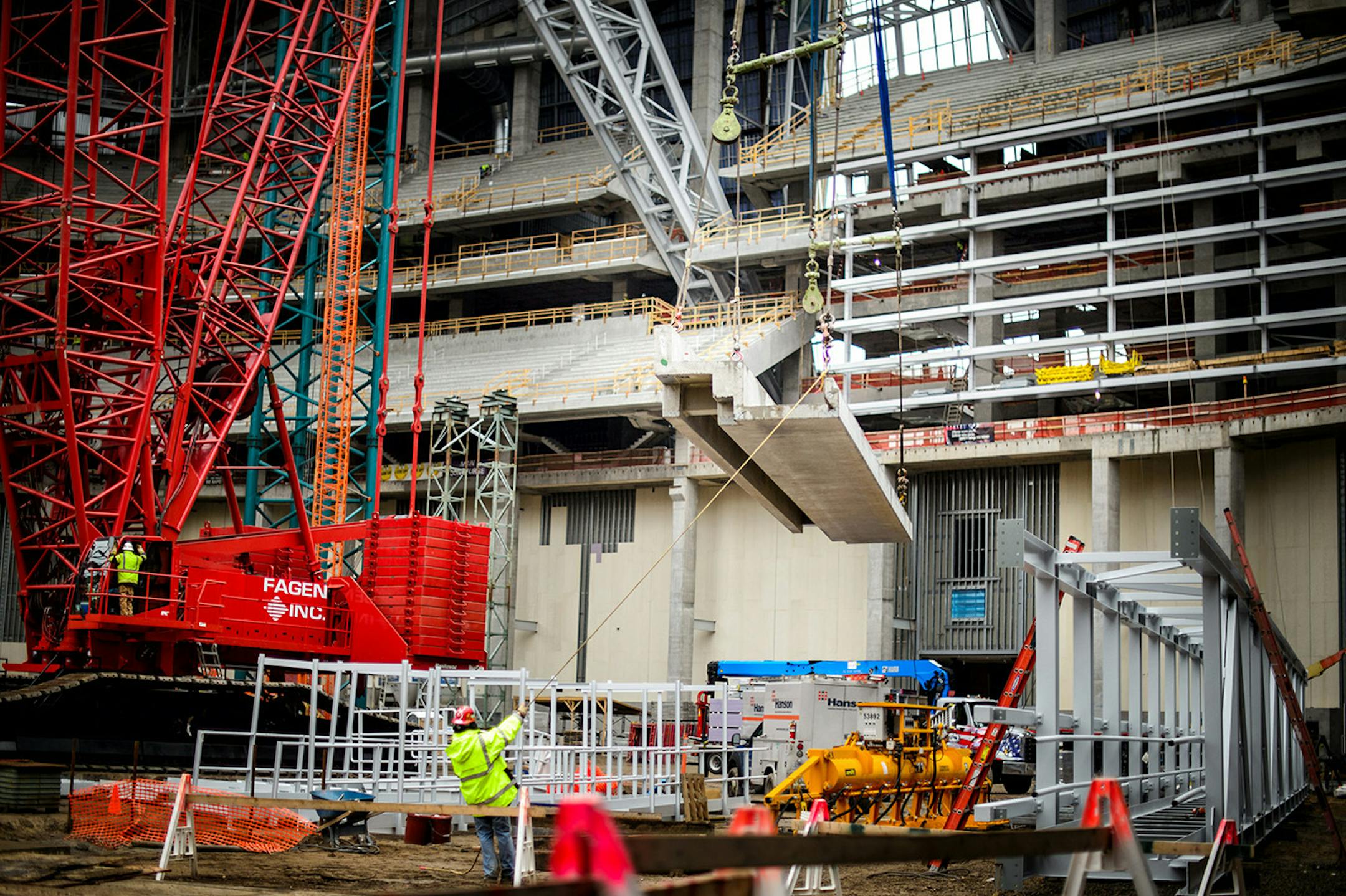 A concrete seating section panel is moved into position in the new Vikings stadium. Thursday, May 14, 2015 Construction update of the new Vikings stadium, Minneapolis, MN