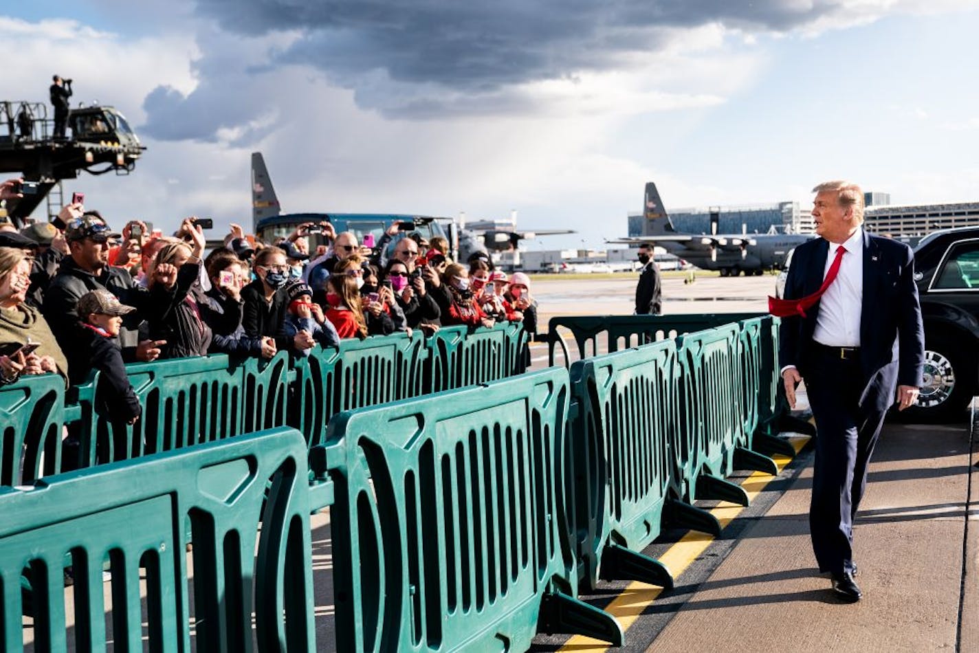 President Donald Trump greets supporters after arriving to campaign in Minneapolis, Wednesday, Sept. 30, 2020.