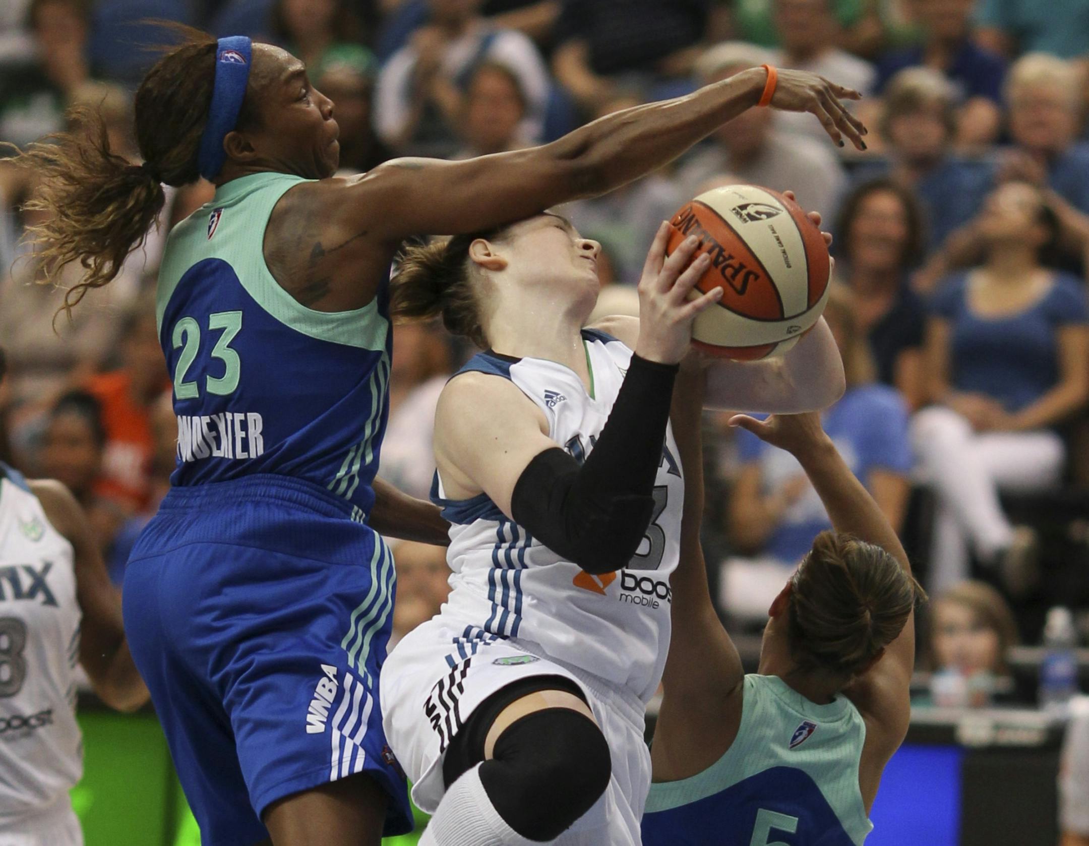 Minnesota's Lindsay Whalen was fouled hard by the Liberty's Cappie Pondexter in the second quarter. New York's Leilani Mitchell also defended.