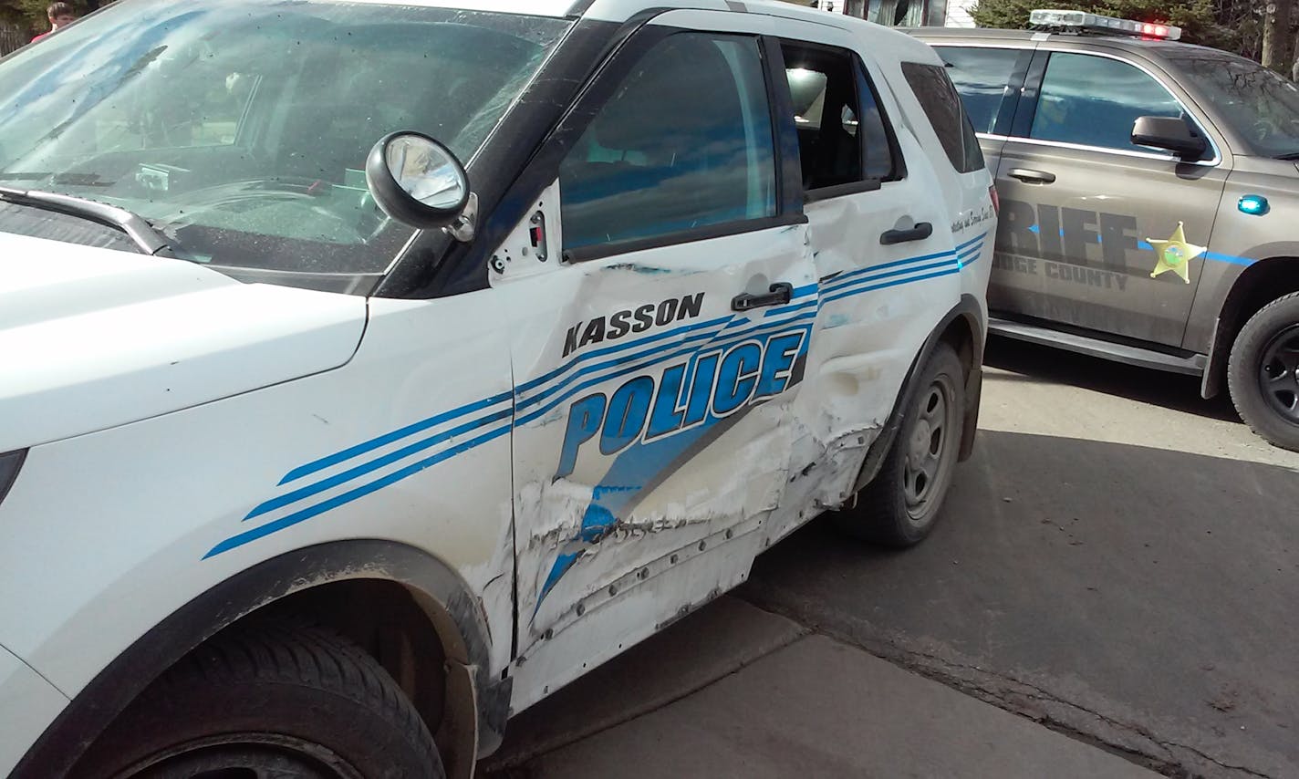 Damage to one of the squad cars involved in the chase with the cement truck.