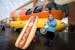 Three-year-old twins Liviana, left, and Piper Beerman of Maple Grove pose for a photo in front of the Wienermobile.