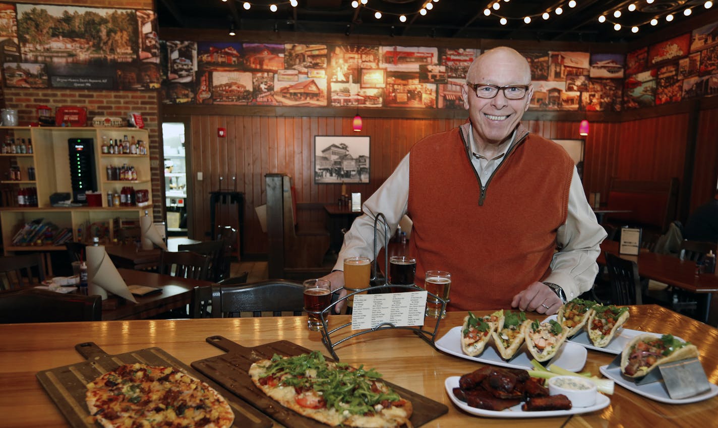 Ed Rensi, CEO Famous Dave's of America, INC. show some of the new food items at the newly remodeled Famous Dave's Legendary Pit Bar-B-Que restaurant on Wednesday, March 4, 2015, in Bolingbrook, Illinois, (AP Photo/Jeff Haynes) ORG XMIT: ILJH105