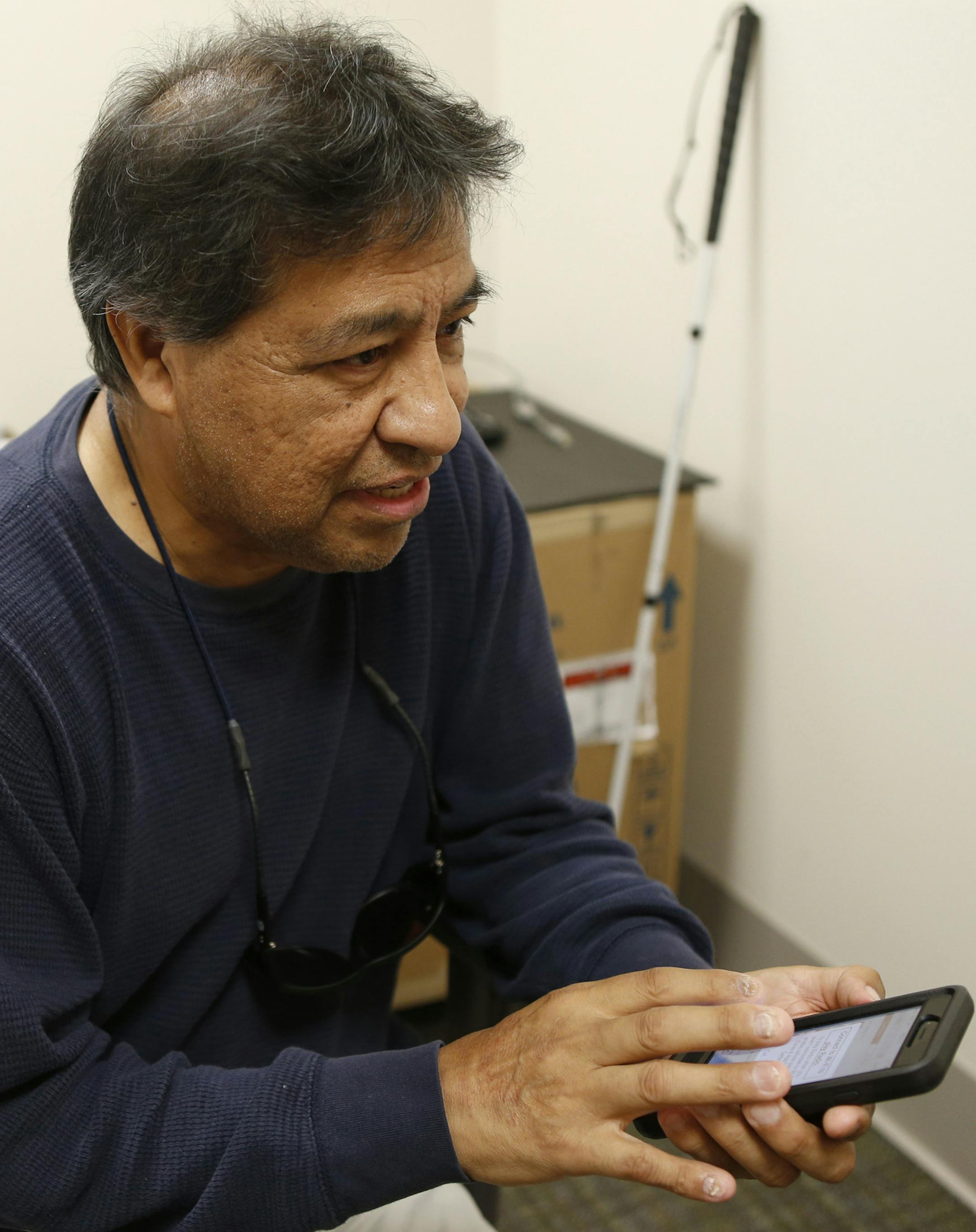 Vet Ruben Morales' iPhone is just like any other, but he uses a screen-reading software called VoiceOver which lets him access all the mobile device's features on August 3, 2015, at the Western Blind Rehabilitation Center in Menlo Park, Calif. (Josie Lepe/Bay Area News Group/TNS) ORG XMIT: 1173023