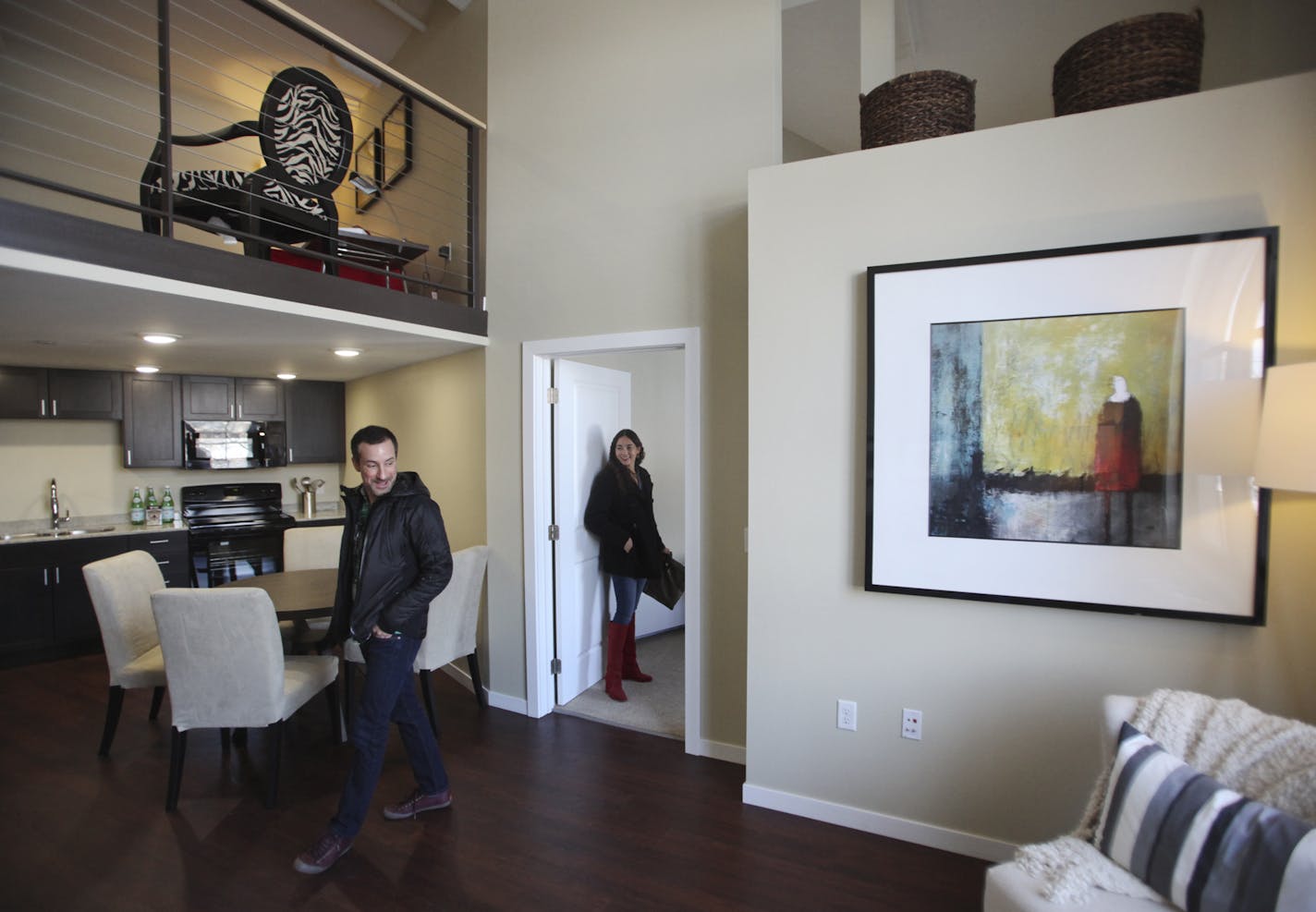 Prospective renter Lisa Bloom of Minneapolis looked over the two-bedroom model at the 430 Oak Grove boutique apartments, luxury rentals near Loring Park in Minneapolis, with friend Vinny Amendola.