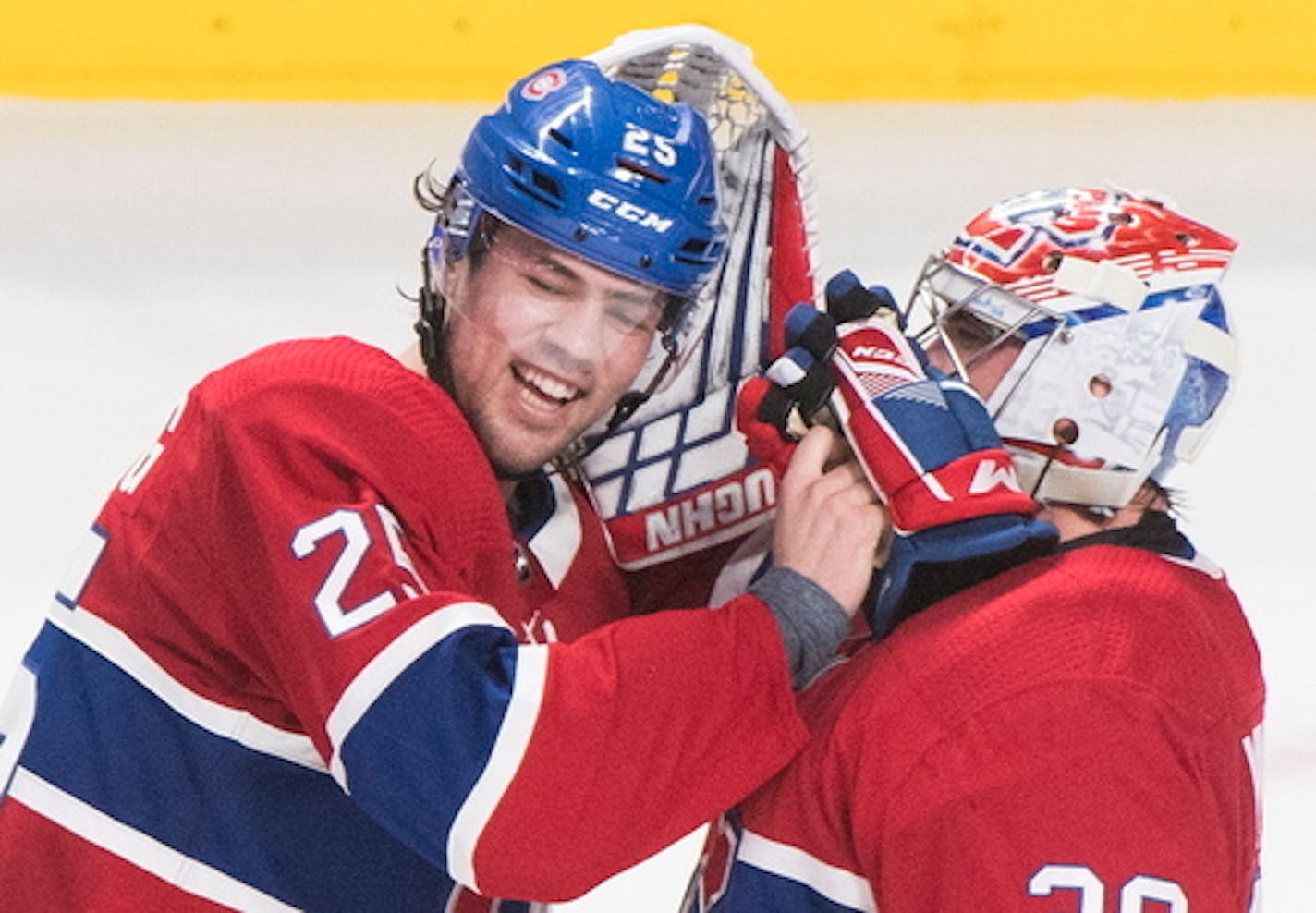 Montreal Canadiens' Ryan Poehling (25) celebrates with teammate and goalie Charlie Lindgren after beating the Toronto Maple Leafs in an NHL hockey game in Montreal, Saturday, April 6, 2019. (Graham Hughes/The Canadian Press via AP)