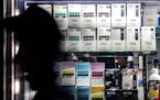 FILE -- Juul products and some competitors at a smoke shop in Manhattan, Nov. 10, 2019. Juul Labs says its focus was always adult smokers, but targeti