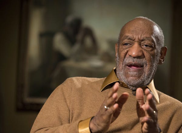 In this Nov. 6, 2014 file photo, entertainer Bill Cosby gestures during an interview at the Smithsonian's National Museum of African Art in Washington