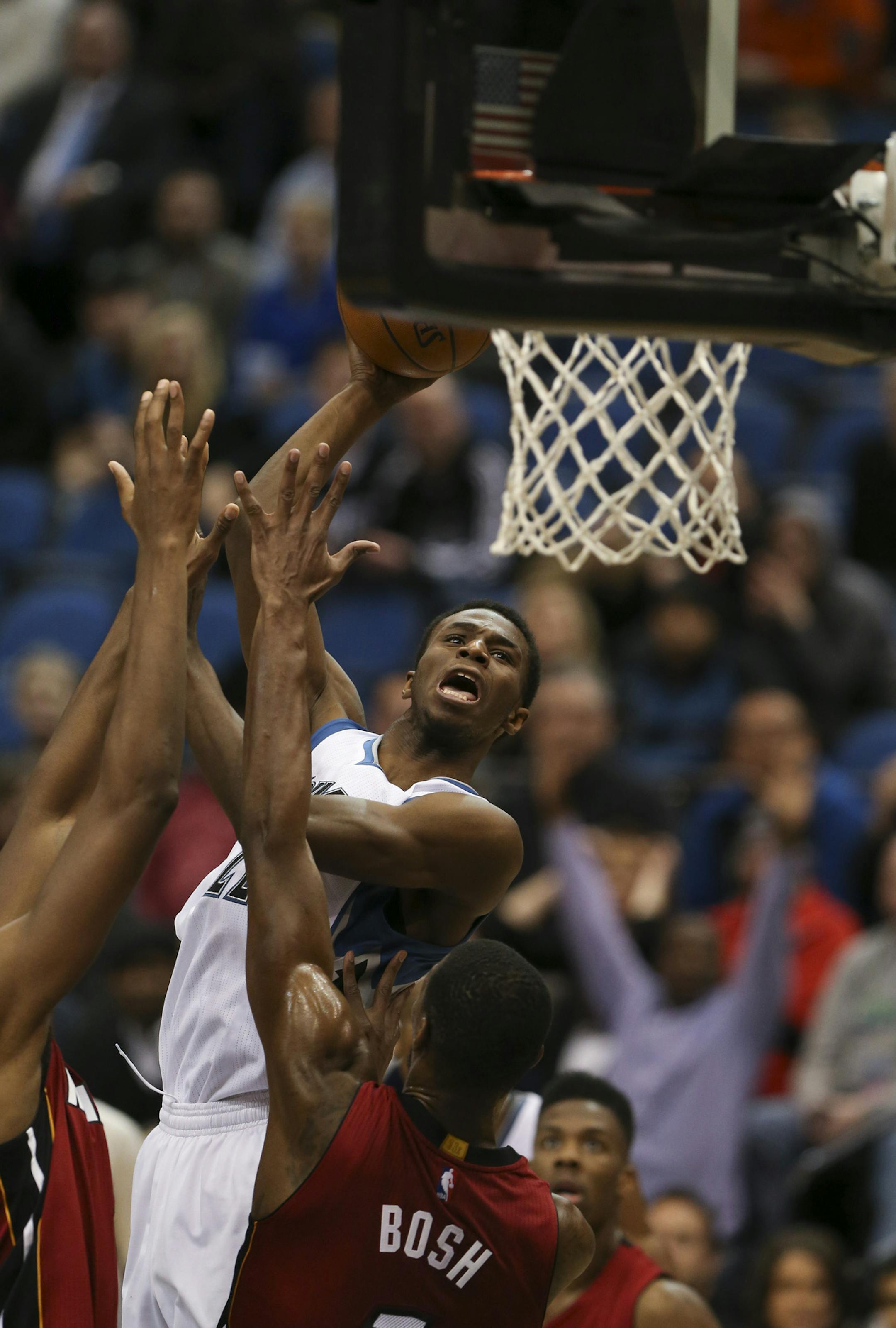 Minnesota Timberwolves forward Andrew Wiggins hit a fourth quarter shot over a pair of Heat defenders to give the Wolves a 100-97 lead Wednesday night at Target Center. ] JEFF WHEELER ‚Ä¢ jeff.wheeler@startribune.com The Minnesota Timberwolves beat the Miami Heat 102-101 an NBA basketball game Wednesday night, February 4, 2015 at Target Center in Minneapolis.