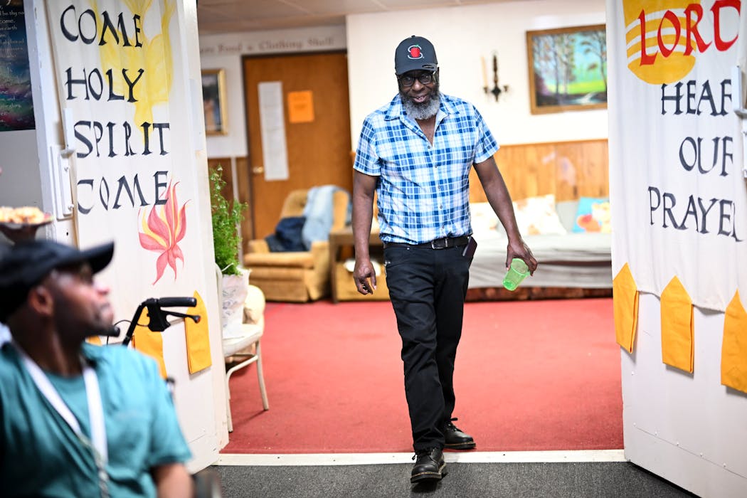 James Page walked back into a support group meeting after greeting someone near the front door at Grace Temple Church in Minneapolis.