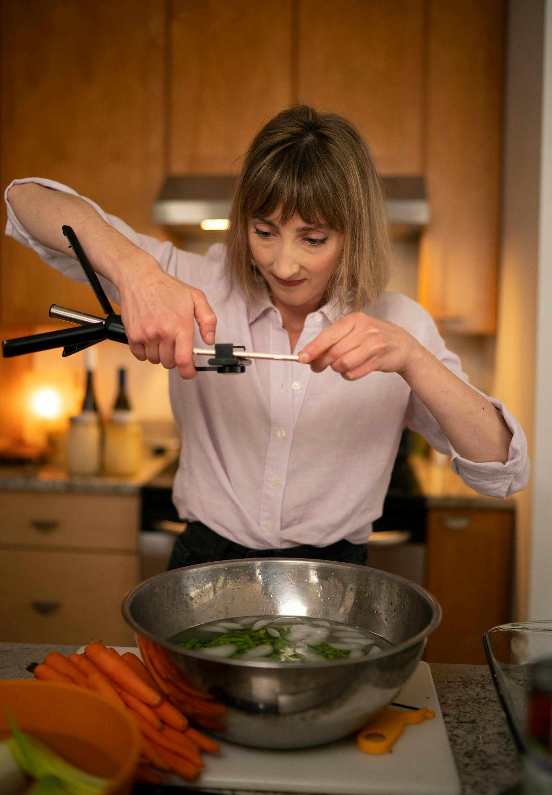Chef Karyn Tomlinson took an overhead shot of asparagus she blanched and then is letting cool in ice water. Since the pandemic began, former Corner Table chef Karyn Tomlinson has been a prolific poster to Instagram, offering free cooking lessons with her show "Karyn's Quarantine Kitchen." She was photographed producing a segment on preparing pureed soups Thursday afternoon, April 23, 2020 in the kitchen of her condo.