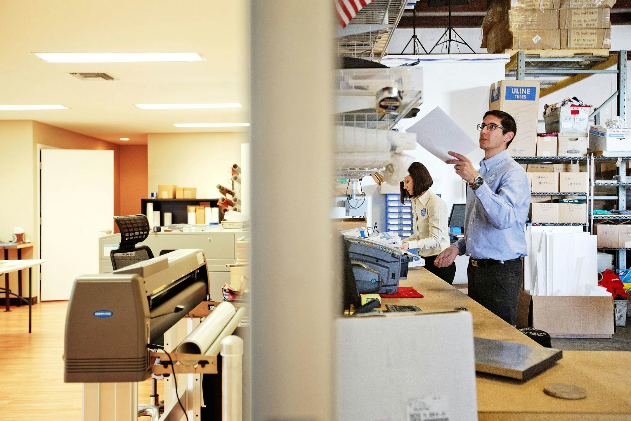 In this Sunday, Feb. 22, 2015 photo, Daniel Rensing, right, and his wife Stephanie, owners of The Smart Baker, work in the back room of their warehouse in Rockledge, Fla. Annual revenue for their company is close to $1 million, up from $130,000 before their March 2012 appearance on the reality TV show "Shark Tank". (AP Photo/David Goldman) ORG XMIT: NYBZ131