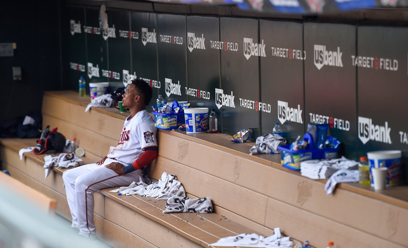 Minnesota Twins' Jorge Polanco sits in the dugout alone after losing to the Chicago White Sox 11-0 during a baseball game, Sunday, July 17, 2022, in Minneapolis. (AP Photo/Craig Lassig)