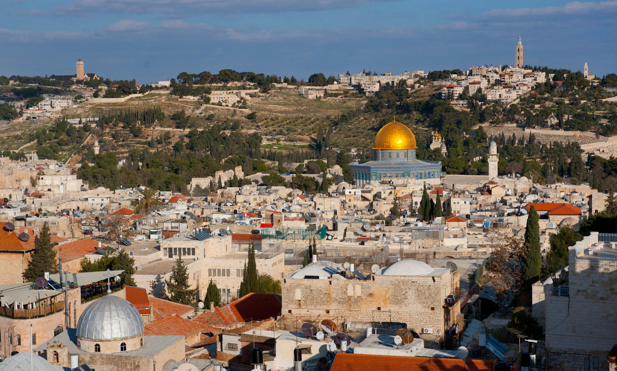Old City of Jerusalem from the citadel, overview with the Dome of the Rock near center (gold) and the Church of the Holy Sepulchre (Silver dome, near left).