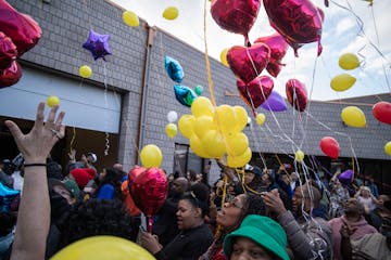 Friends and family of Sammy McDowell, including sister Shaawn-Dai McDowell, in the green hat, celebrated his life during a picnic and balloon release 