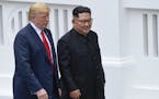 U.S. President Donald Trump and North Korea leader Kim Jong Un walk from lunch at the Capella resort on Sentosa Island Tuesday, June 12, 2018 in Singa