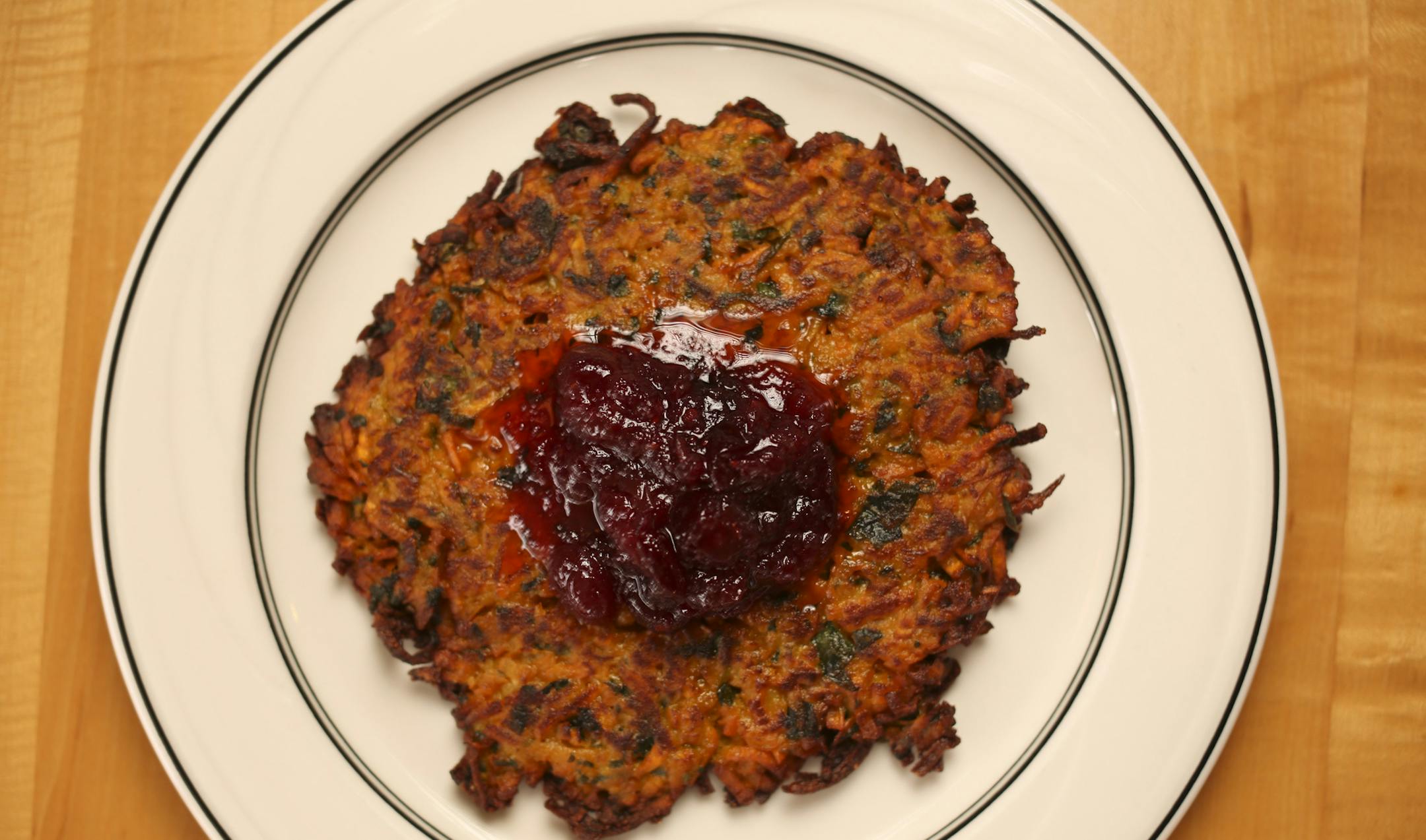 Channuka and Thanksgiving fall on the same day this year, a once in 70,000 year occurrence. The local Jewish community looks at how to handle a traditional meal and customs when it bumps into other traditions. A sweet potato latke topped with cranberry sauce, as prepared by Rye Deli and Bar in Minneapolis Monday afternoon, November 4, 2013. ] JEFF WHEELER ‚Ä¢ jeff.wheeler@startribune.com