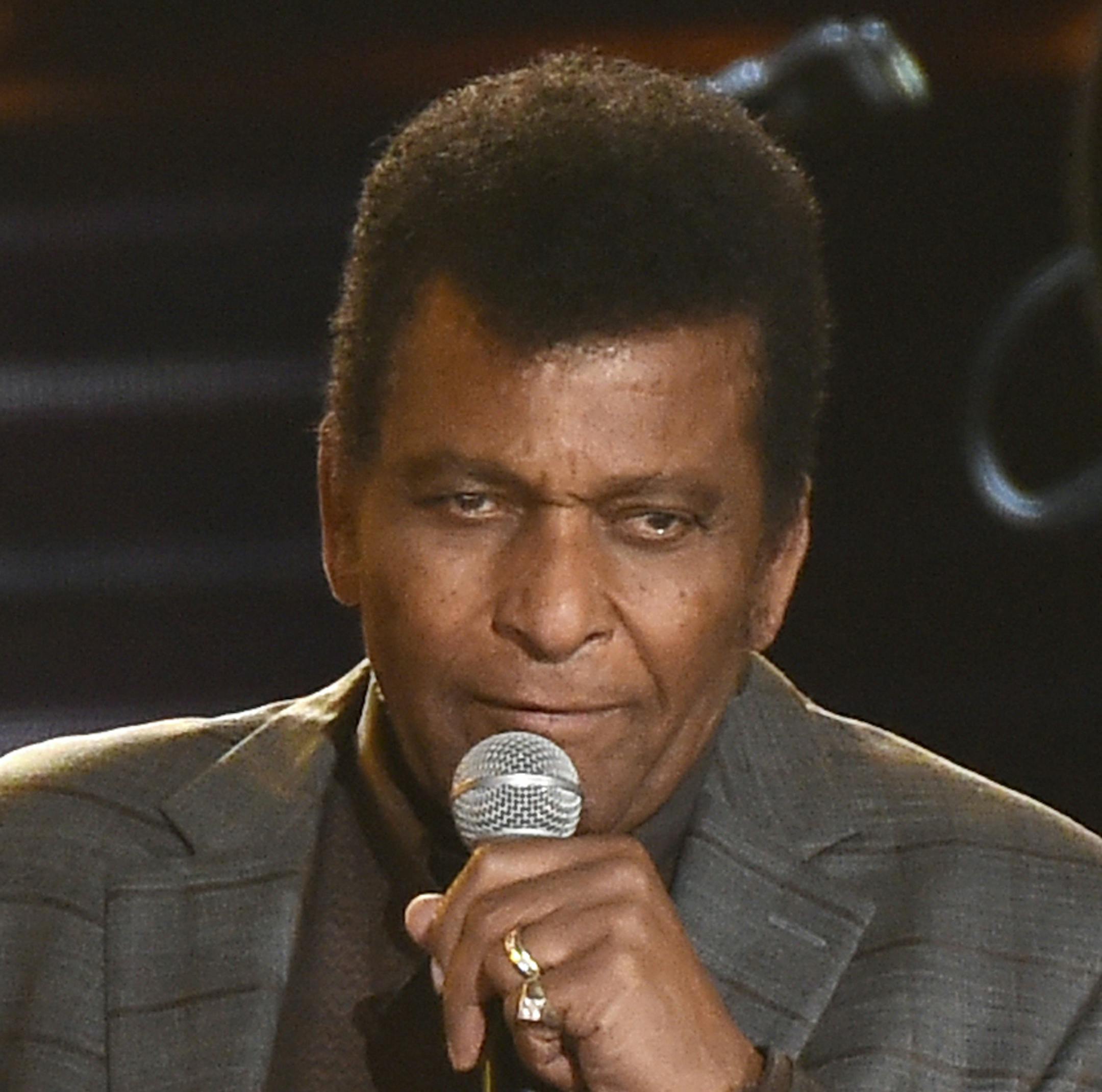 FILE - In this Nov. 2, 2016 file photo, Charley Pride performs "Kiss An Angel Good Morning" at the 50th annual CMA Awards at the Bridgestone Arena in Nashville, Tenn. Pride finds himself in the spotlight with two upcoming PBS projects: "Country Music," Ken Burns' film on the genre's evolution and the people who created it, and "Charley Pride: I'm Just Me," airing as part of the American Masters series on Feb. 22, 2019. (Photo by Charles Sykes/Invision/AP, File)