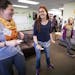 Haley Olson, left, Hannah Kane and Emma Swift played Just Dance on the Nintendo Wii at Stillwater's Valley Friendship Club. The eight-year-old gatheri