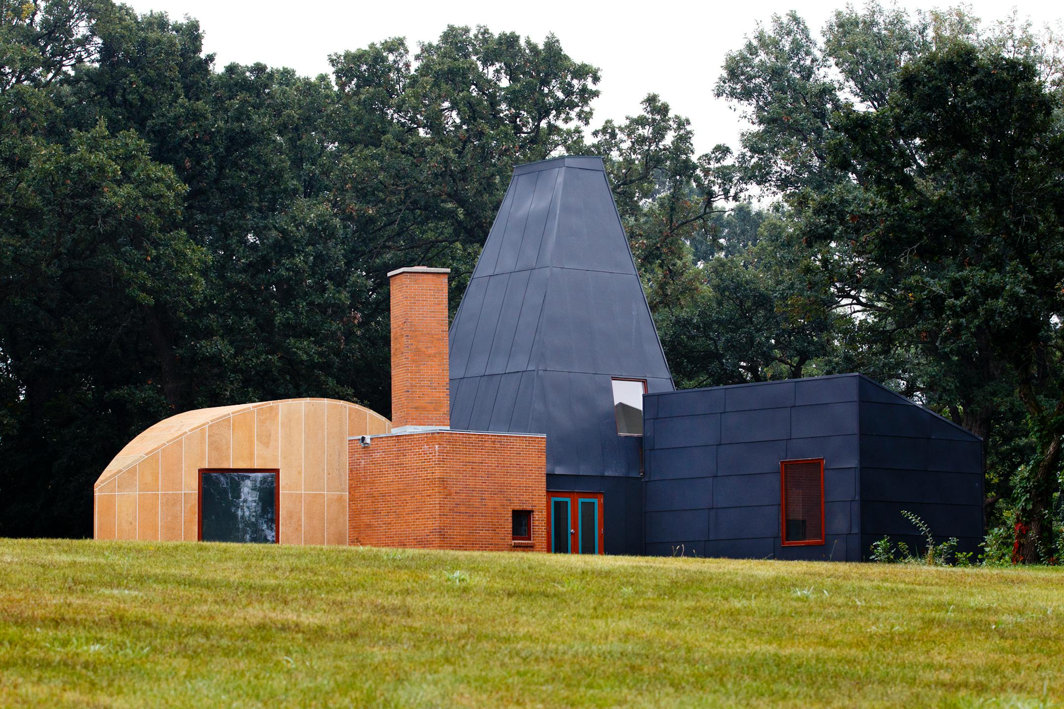 credit: Mike Ekern, University of St. Thomas  The Winton Guest House, designed by renowned architect Frank Gehry, stands assembled in its final location at the University of St. Thomas' Gainey Center in Owatonna, Minn. August 31, 2011.  The house was moved, in pieces, to this spot from its original location in Orono, Minn.