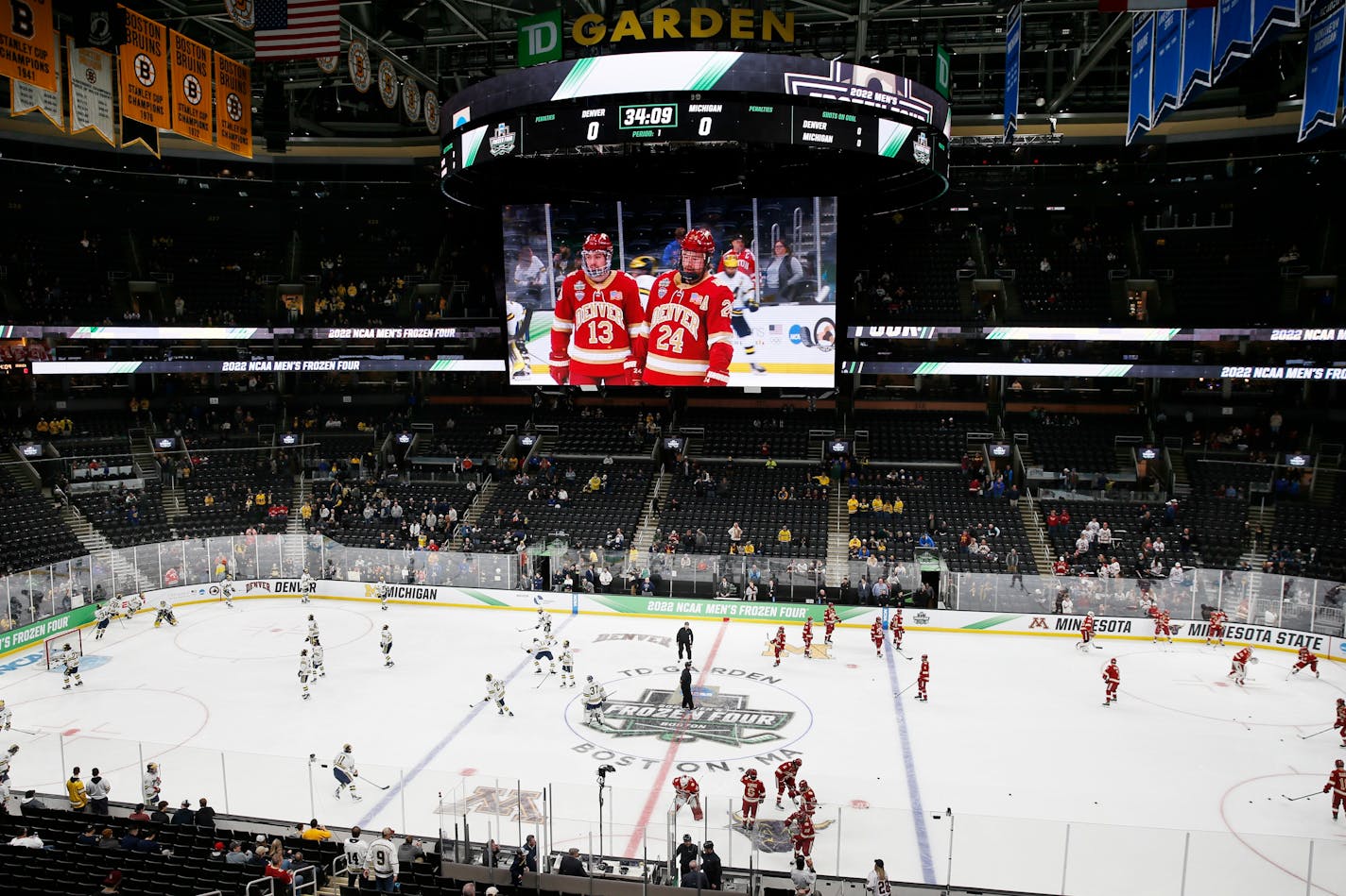 Michigan and Denver warm up before an NCAA men's Frozen Four semifinal hockey game, Thursday, April 7, 2022, in Boston. (AP Photo/Michael Dwyer)