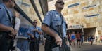 Minneapolis Police Sgt. K.A. Angerhofer and SWAT team members stood outside Target Field after the Twins game in Minneapolis on Sunday.
Minneapolis Po