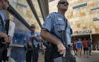 Minneapolis Police Sgt. K.A. Angerhofer and SWAT team members stood outside Target Field after the Twins game in Minneapolis on Sunday.
Minneapolis Po