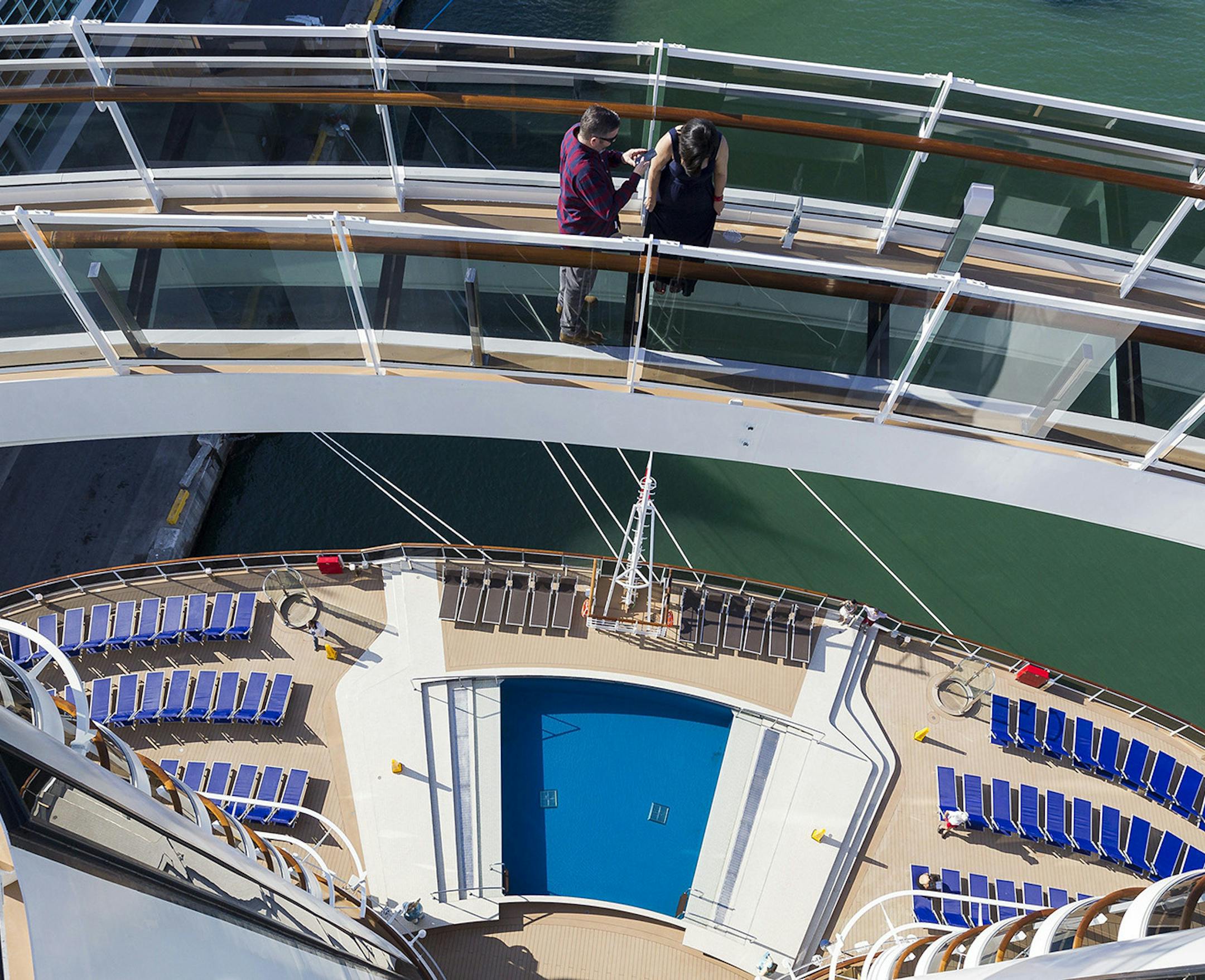 Jorge Jimenez, 43, and his wife, Yomari Jimenez, 38, walk across the "Bridge of Sighs" on MSC Cruises' newest ship, Seaside, as it was docked at PortMiami on Friday, Dec. 22, 2017. The cruise ship has various restaurants, digital displays adorning its atrium and a zipline among other amenities guests can enjoy. (Matias J. Ocner/Miami Herald/TNS)
