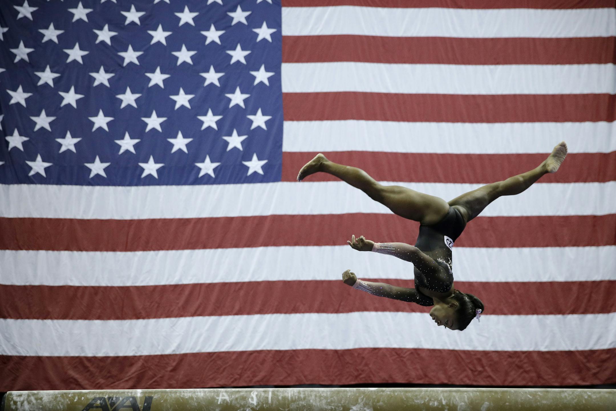 Simone Biles competes in the beam during the senior women's competition at the 2019 U.S. Gymnastics Championships Sunday, Aug. 11, 2019, in Kansas City, Mo. (AP Photo/Charlie Riedel)