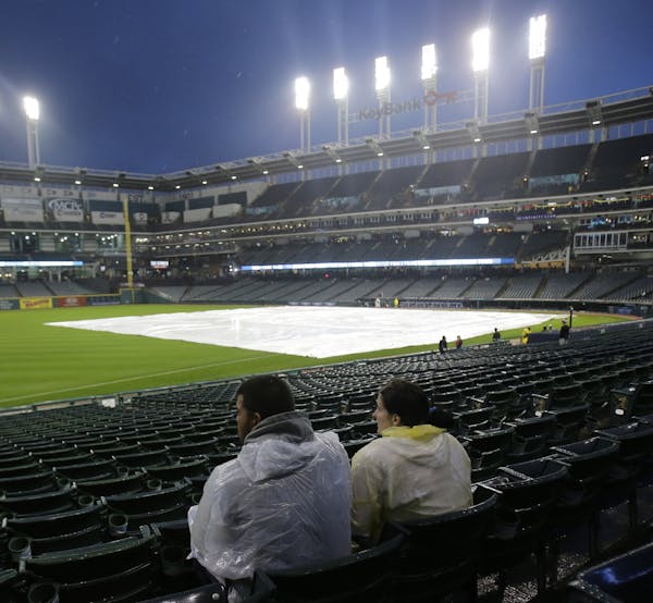 Two fans endured a rain delay in Cleveland before they called the game. They will play a doubleheader Wednesday starting at 3:10 p.m.