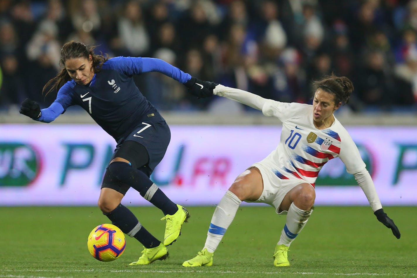 France defender Amel Majri, left, vies for the ball with U.S. forward Carli Lloyd during an international friendly, a 3-1 French victory, on Jan. 19 at the Oceane stadium in Le Havre, France.