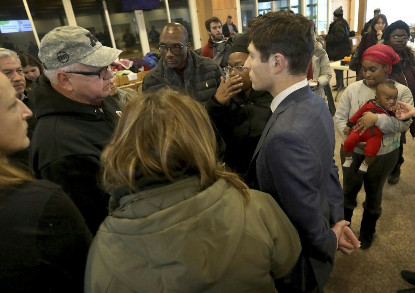 Minnesota Gov. Tim Walz and Minneapolis Mayor Jacob Frey talked Thursday with displaced residents of the Francis Drake Hotel.