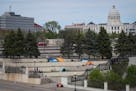 Tents were set up on cement stairs between the History Center and Catholic Charities and in the shadow of the state capitol building in St. Paul on Th