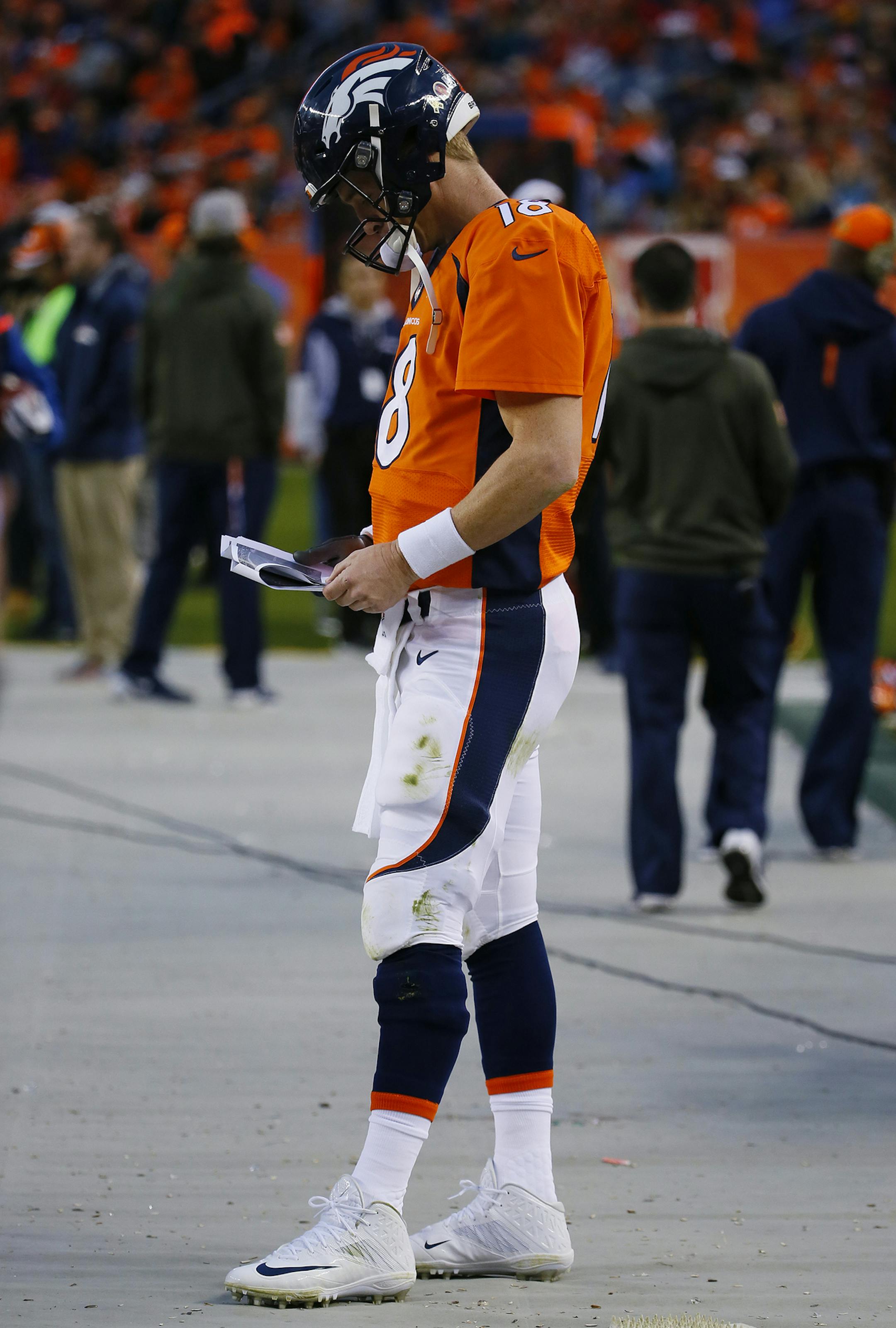 A dejected Denver Broncos quarterback Peyton Manning stands on the sidelines after being pulled from an NFL football game between the Denver Broncos and the Kansas City Chiefs, Sunday, Nov. 15, 2015, in Denver. (AP Photo/Jack Dempsey) ORG XMIT: OTK