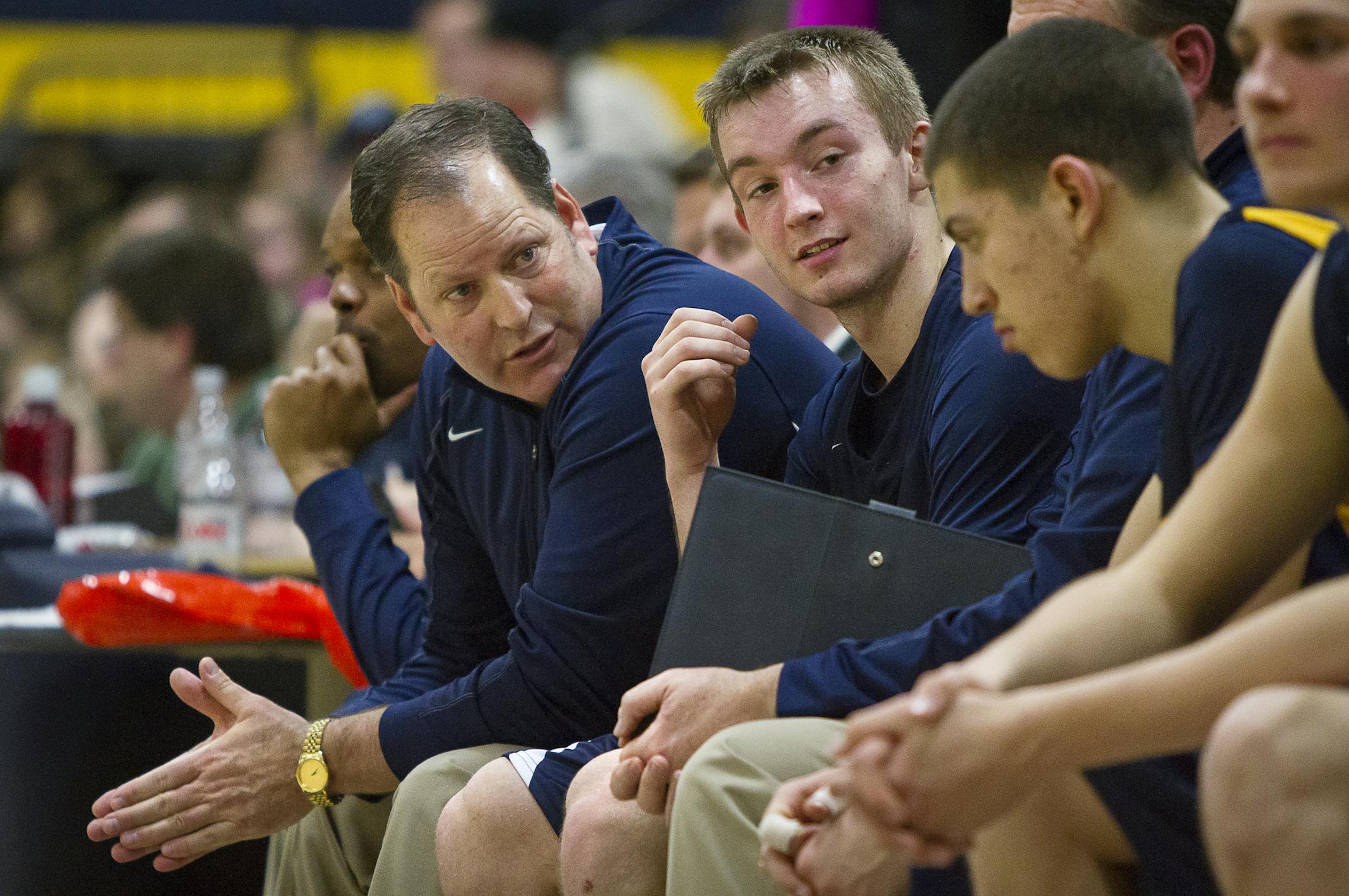 Prior Lake head coach Dan Rubischko, left, and guard Jon Sobaski, center, confer during the second half of the basketball game between Prior Lake and Apple Valley at Prior Lake High School, Friday, January 24, 2014. [BEN BREWER ‚Ä¢ Special to the Star Tribune Assignment # 77251 DATE: January 24, 2014 SLUG: PSOUTH012914 EXTRA INFORMATION: