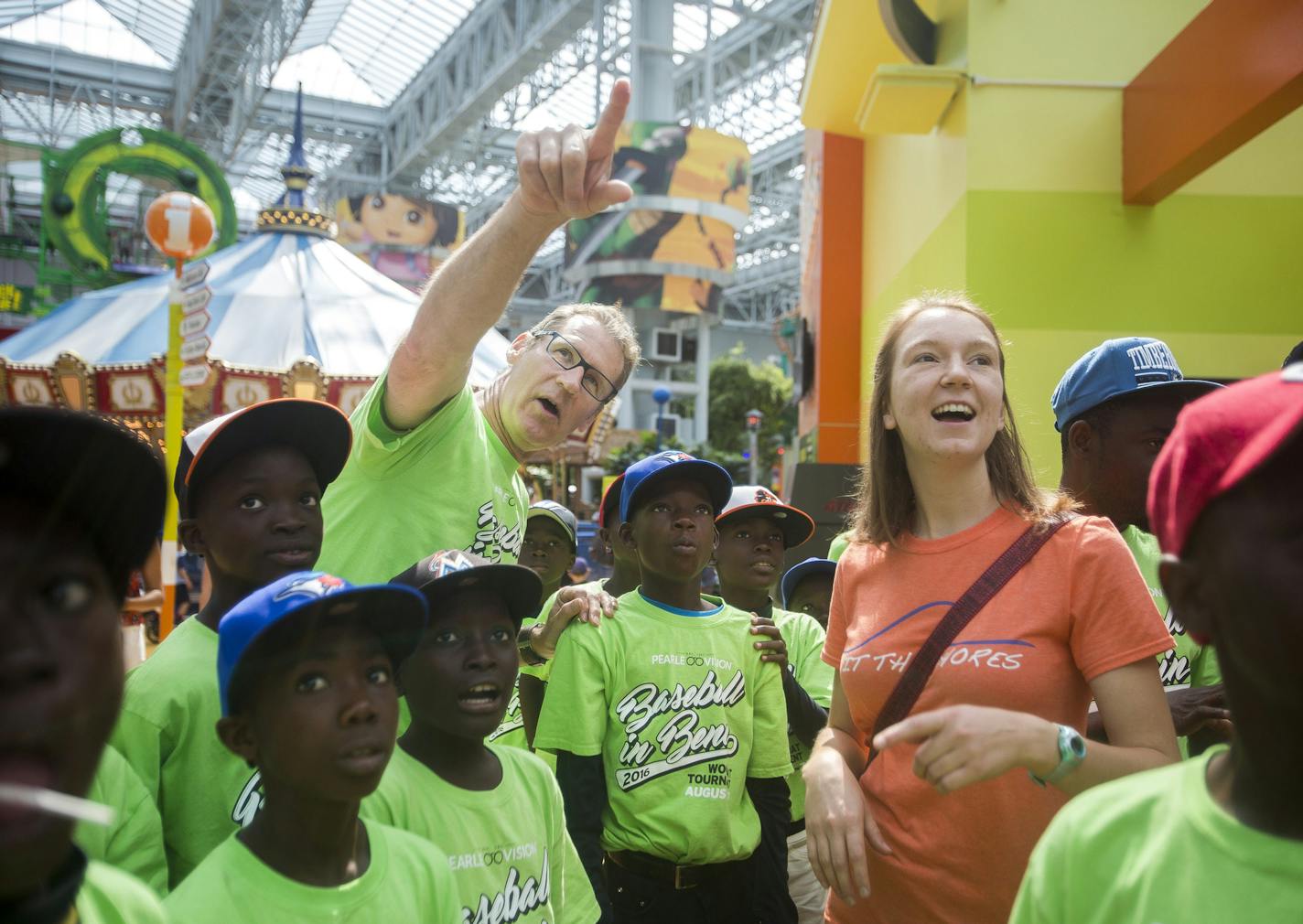 Baseball in Benin president Gary Tonsager, center, points out different rides to Team Benin at the Nickelodeon Universe theme park at the Mall of America on Monday, August 1, 2016 in Bloomington, Minnesota. ] Timothy Nwachukwu &#x2022; timothy.nwachukwu@startribune.com A team of 12 young Beninese little league baseball players and three coaches were given a once-in-a-lifetime opportunity to be flown in to train and play in the Pearle Vision Baseball in Benin Wood Bat Tournament, a weekend-long l