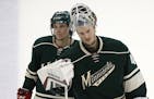 Minnesota Wild left wing Erik Haula (56) and goalie Devan Dubnyk (40) left the ice dejected after their 4-3 loss to Chicago Thursday night. ] CARLOS G