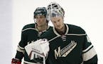 Minnesota Wild left wing Erik Haula (56) and goalie Devan Dubnyk (40) left the ice dejected after their 4-3 loss to Chicago Thursday night. ] CARLOS G