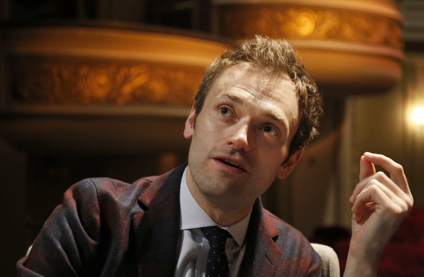 FILE - In this April 5, 2016, file photo, Chris Thile speaks during an interview at the Fitzgerald Theater in St. Paul, Minn. Thile, who replaced Garrison Keillor as host of "A Prairie Home Companion" said the allegations against Keillor came as "heartbreaking news." Thile on Saturday, Dec. 2, 2017, addressed alleged improper conduct by Keillor in the opening minutes of the first show to be broadcast since news of the allegations broke. (AP Photo/Ann Heisenfelt, File)