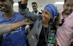 Ilhan Omar, shown last week with supporters after her DFL primary victory, released a statement Wednesday that sought to clear up questions about her 