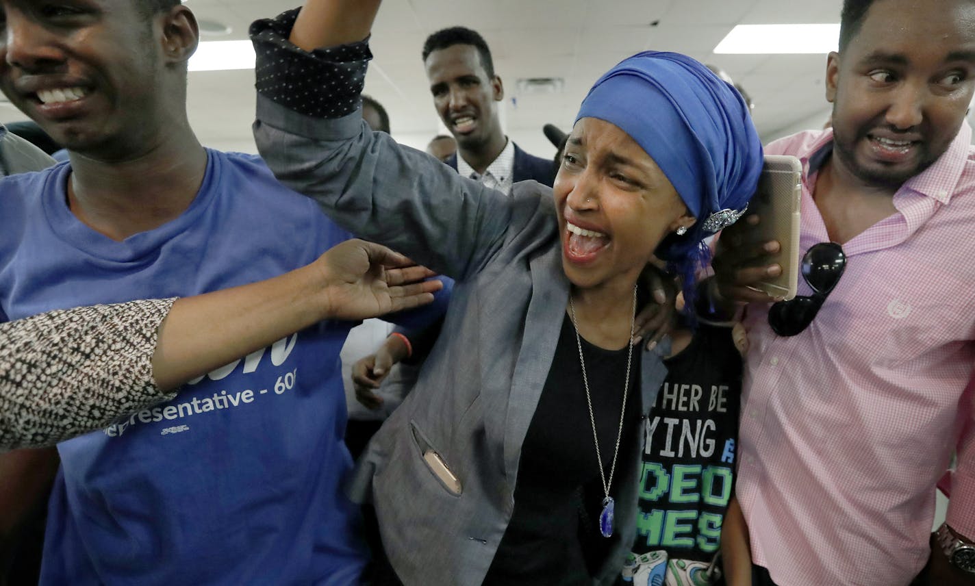 Ilhan Omar, shown last week with supporters after her DFL primary victory, released a statement Wednesday that sought to clear up questions about her marital history.