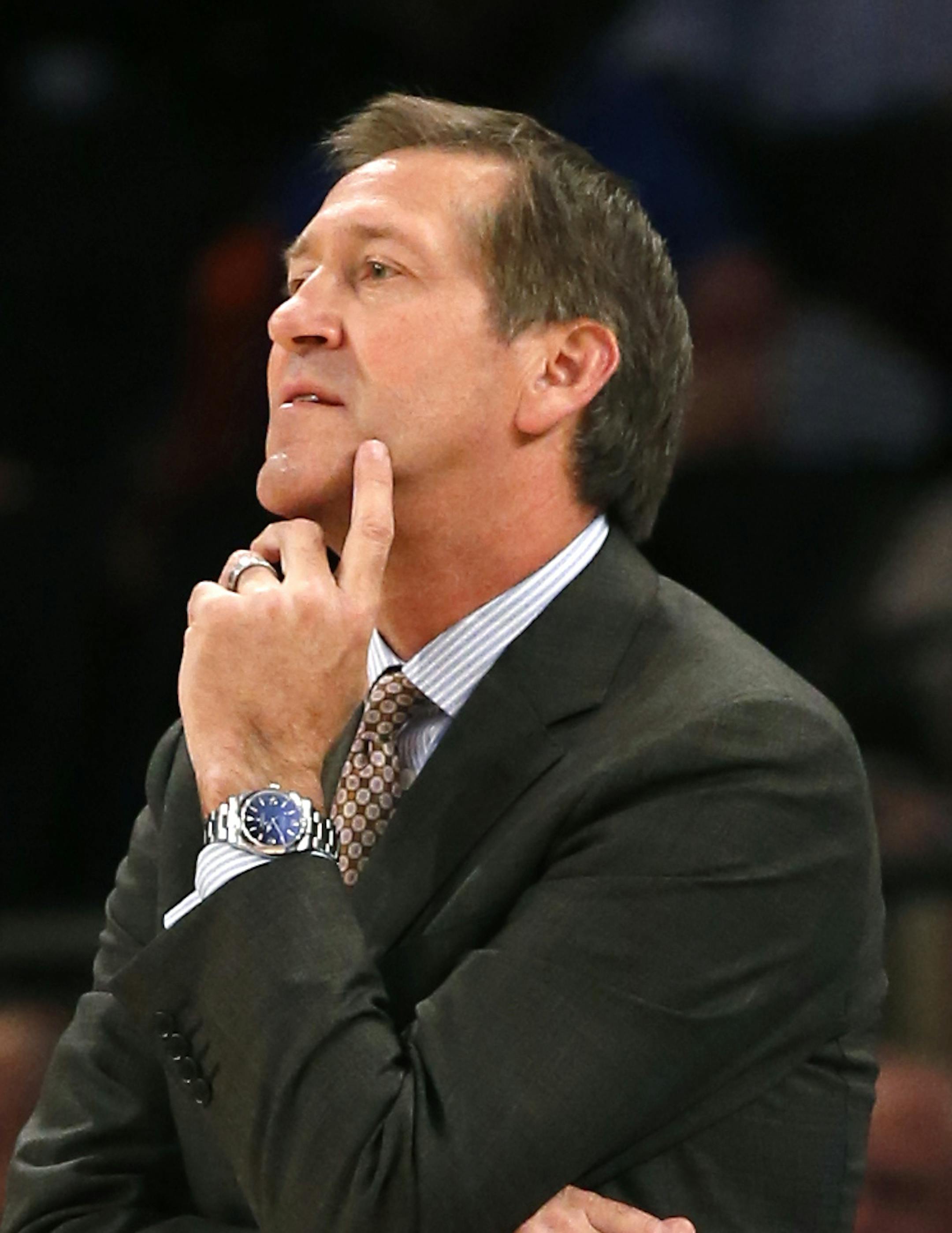New York Knicks head coach Jeff Hornacek watches his team in the second half of a preseason NBA basketball game at Madison Square Garden in New York, Monday, Oct. 10, 2016. The Knicks defeated the Wizards 90-88. Knicks Joakim Noah is at left, on the bench. (AP Photo/Kathy Willens) ORG XMIT: OTKKW103